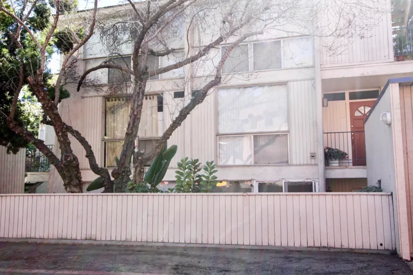 THE HOUSE IN THE MISSION BELWOOD WITH BALCONI, DOOR, BANANA TREE.