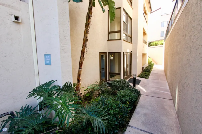 An elegant mansion with a wall and narrow pavement in Mission Greens community