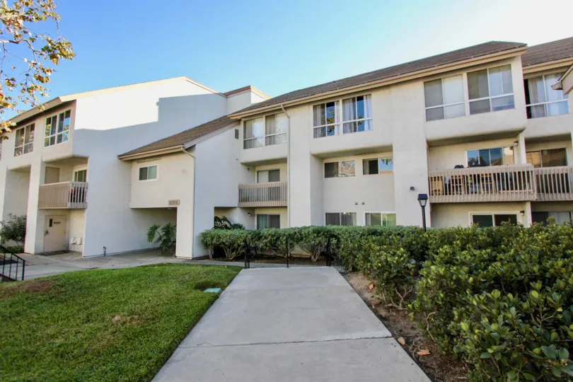 A sunny day in the area of Mission Heights, entrance, balcony, sidewalk, condos
