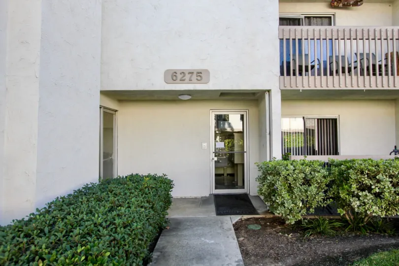Mission heights community Mission Valley California apartment entrance balcony sliding glass doors shrubbery landscaping