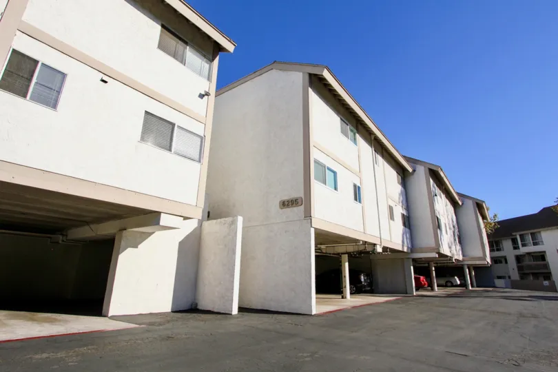 A sunny day in the area of Mission Heights, Garage, car, driveway, condos