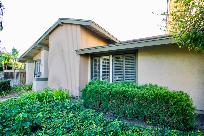 A view of a single house surrounded by plentiful greens in the Mission Playmor community of Mission Valley, California
