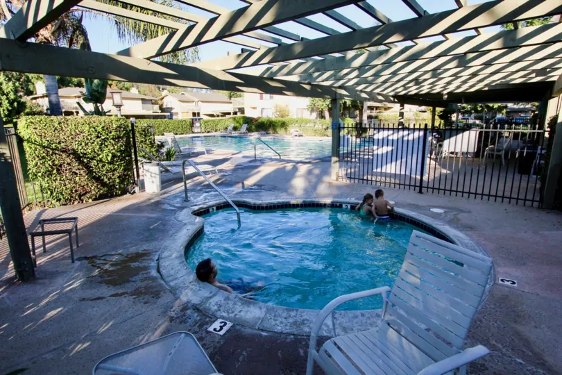A small pool with some people in it in Mission Playmor neighborhood