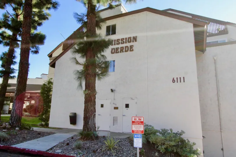 Pine trees as seen from the side entrance as viewed from the parking area of the Mission Verde apartments in Mission Valley.
