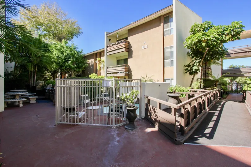 A red patio sits in the shade at the Mission Valley condos