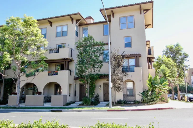 A sunny day in the area of Mission Walk, doors, balconies, trees, window