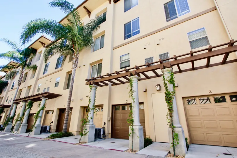 Apartment complex with nice paint job and palm trees in Mission Valley California