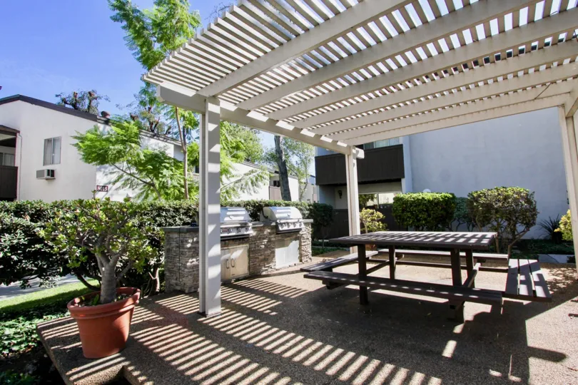 Shaded outdoor grills and picnic area at Park Villas South in Mission Valley, CA