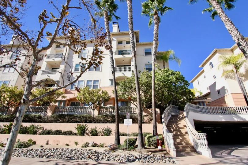 A sunny day at a white stucco apartment in Rio Del Oro