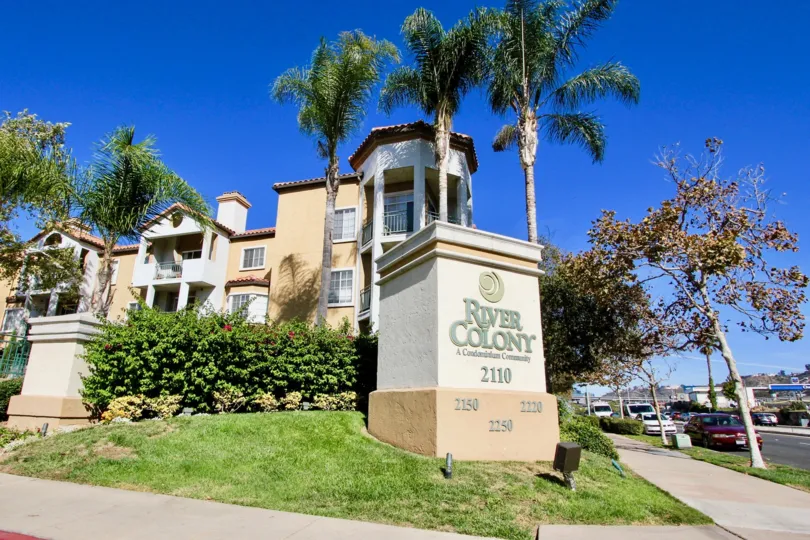 Community sign in front of residential buildings at River Colony in Mission Valley California