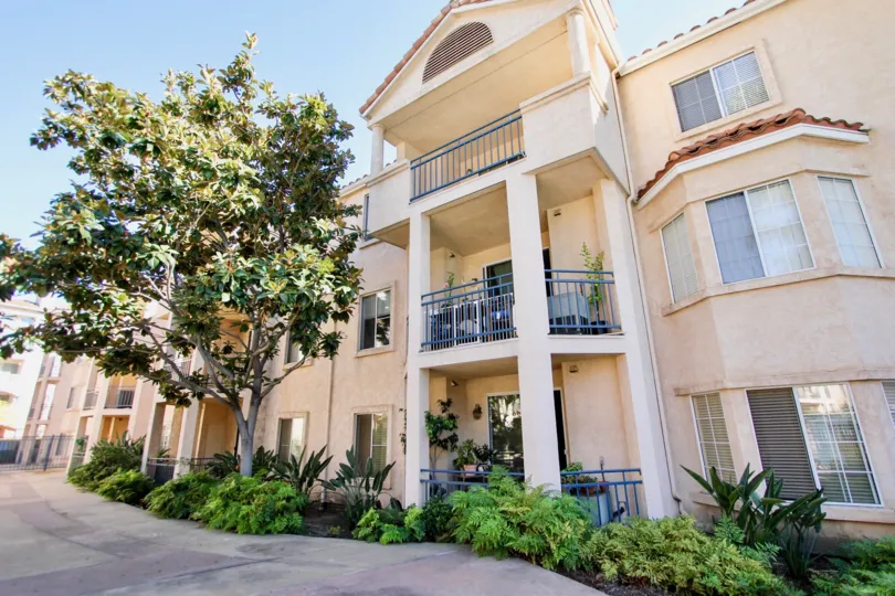 A walking path winds in front of a building at the River Scene condos.