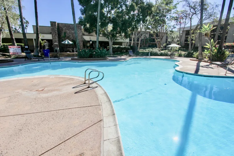 A cute swimming pool with calm blue water in the Bluffs community