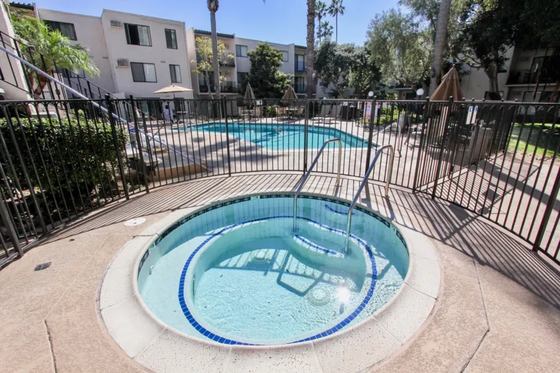 A gated hot tub in the Franciscan neighborhood on a sunny day.