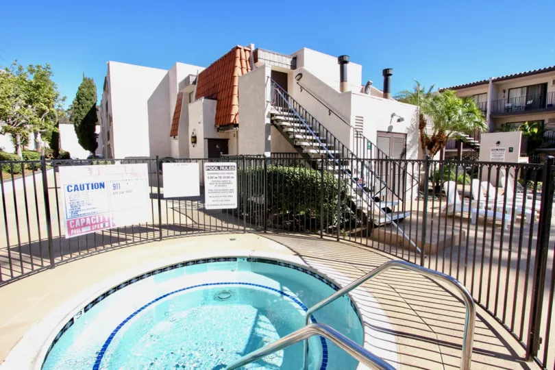 The gated hot tub on a sunny day at the Franciscan community in Mission Valley, CA.