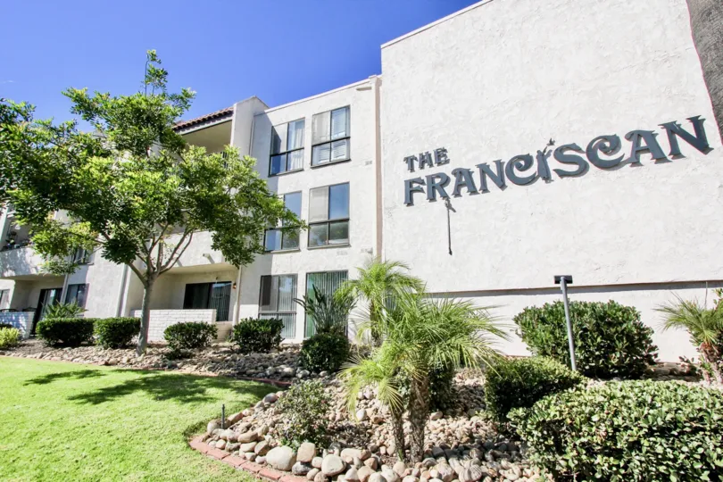 A view of The Franciscan sign and apartment buildings in Mission Valley, California