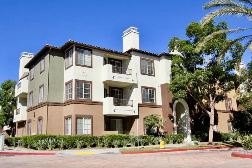 A new and well-tended residential complex, surrounded by a quiet street and trees, at The Missions at Rio Vista in California