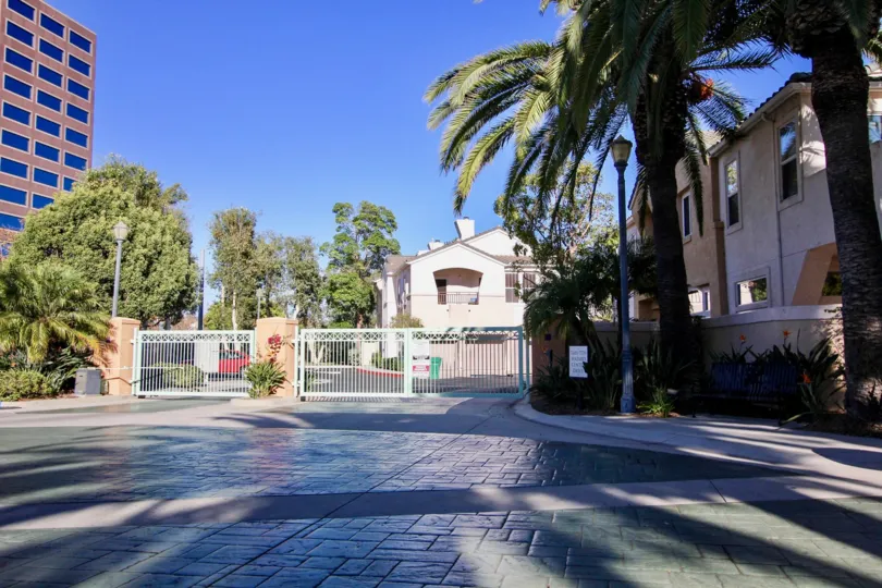 gated community corner with palm trees in union square in mission valley, CA