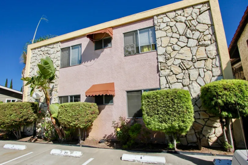 A two-storey residence in 33rd Street Manor covered in concrete and stone cladding.
