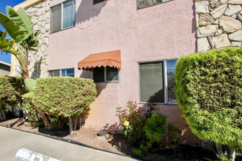 Side of apartment building at 33rd Street Manor with landscaping in Normal Heights, Ca.