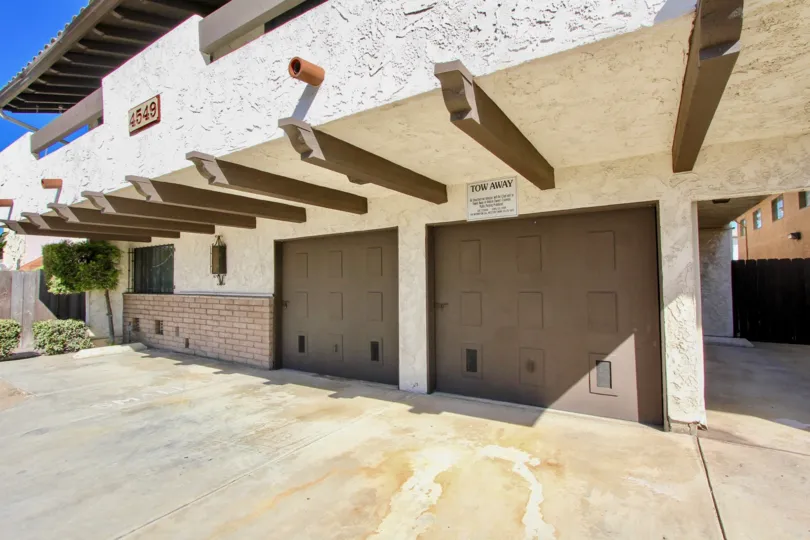 Two brown garage doors with small squares at 33rd Streetn CA in Normal heights