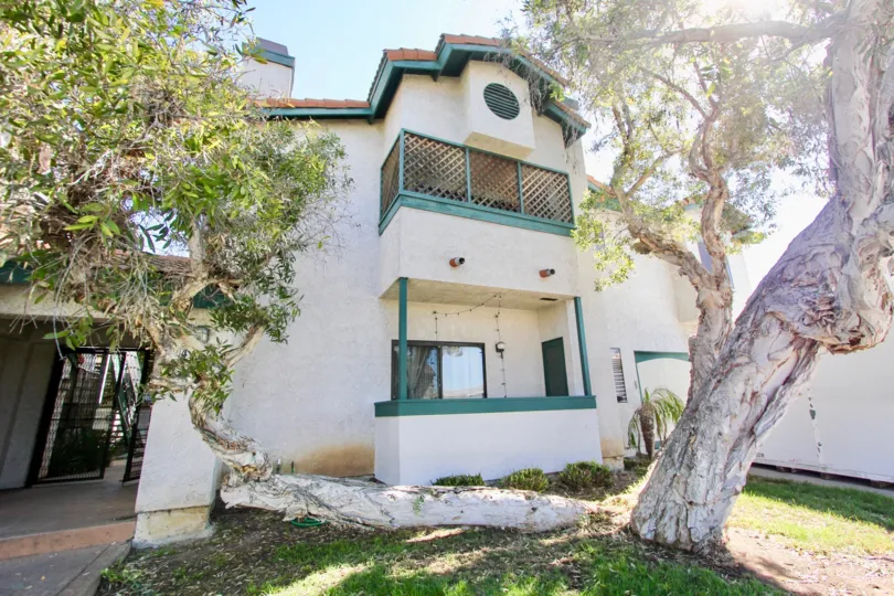 A sunny day in the area of 34th Street Villas, outside, tree, porch, balcony, doors, stairs