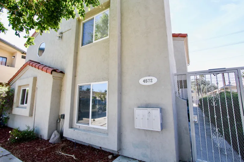 Side walkway with metal gate at 4572 Kansas St in Normal Heights, Ca.