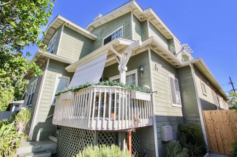 Two story gray home with a white patio located at 4755 Wilson in Normal Heights CA