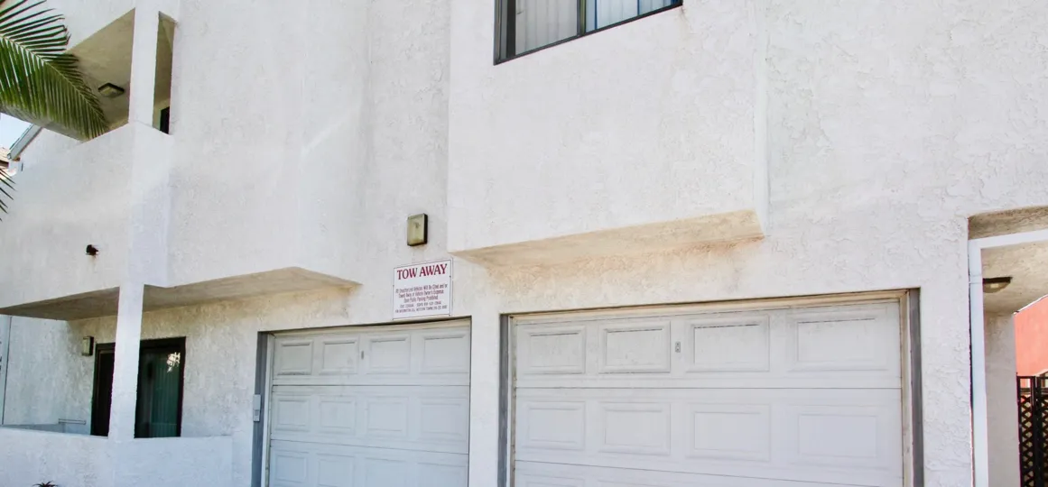 Tow away sign for garage space of A2I Condominiums in Normal Heights, California