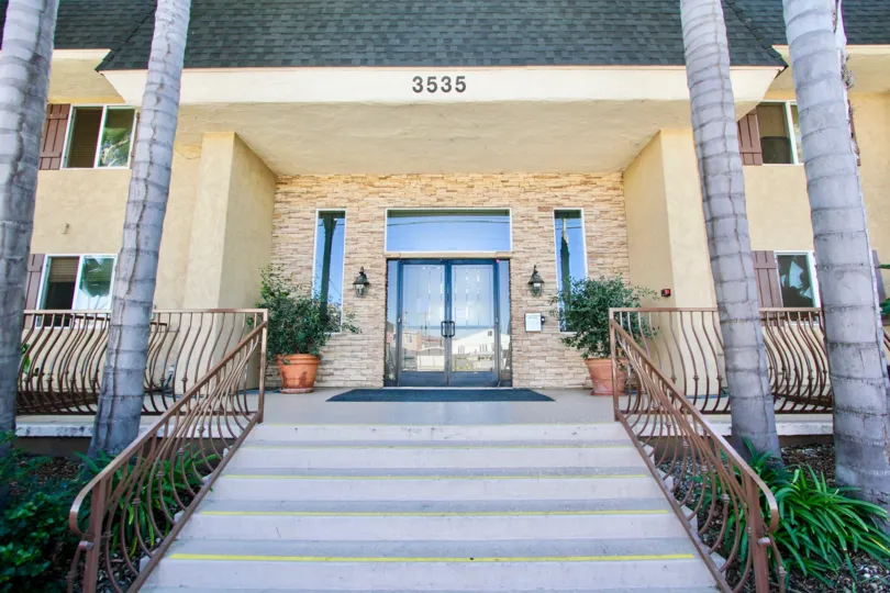 A grand porch to a clubhouse or townhouse in Adela community.
