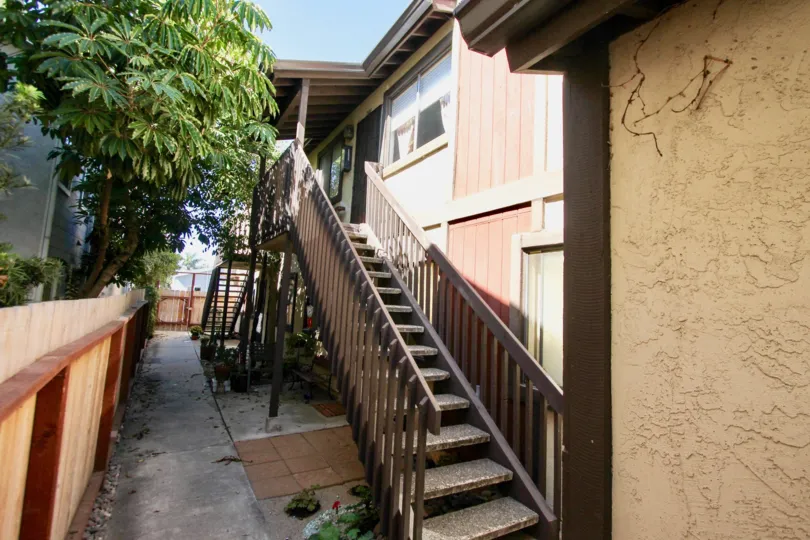 A sunny day in the area of Casa Heights, outside, trees, stairs, patios, sidewakl, condos