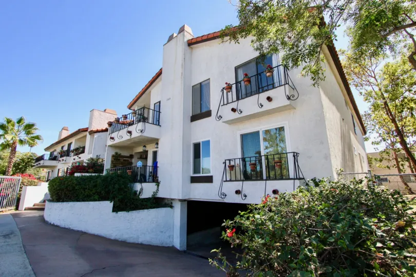 A beautiful building with flowers and trees in casa Monterey of normal heights