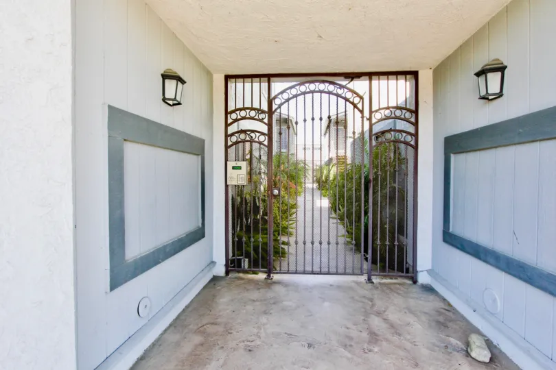 An entrance place with a grilled gate with lights in a villa in Cherokee Court of Normal Heights