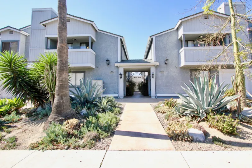 A sparse garden looks out onto the gated community of Cherokee Court, in Normal Heights, CA.