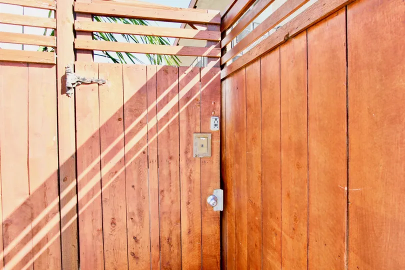 THE Main gate is made in wood with handle and locker of the Villa in City Lights