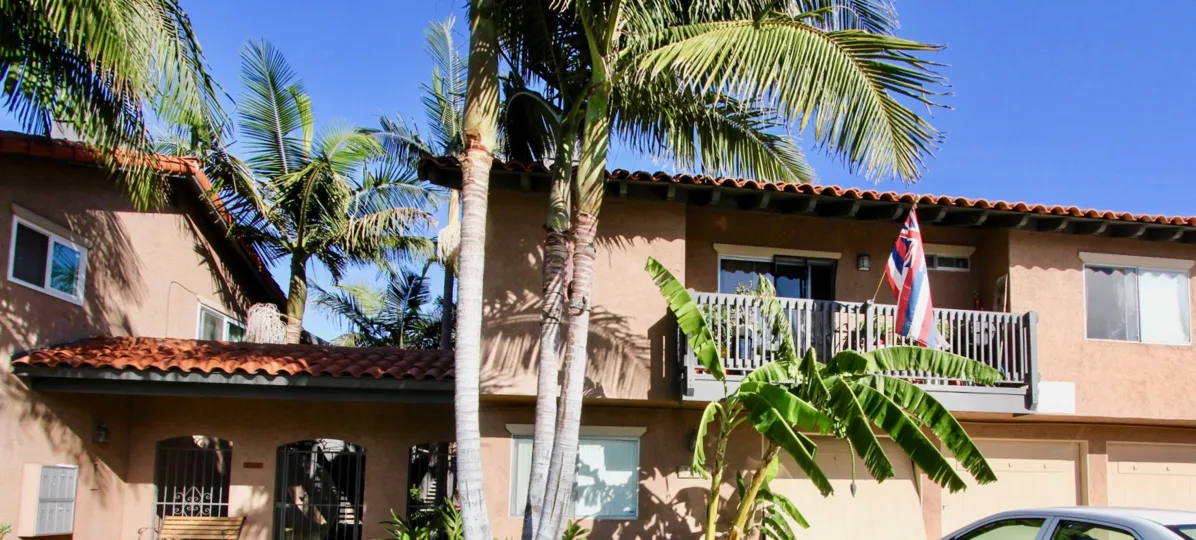 Condo, Nice balcony, garages available, gated entrance, mailboxes, palm trees, tile roof, stucco exterior