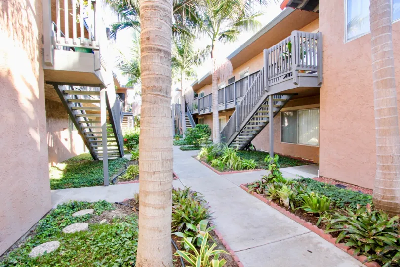A sunny day in the area of Cleveland Avenue Condos, outside, garden, sidewalk, stairs, palm trees