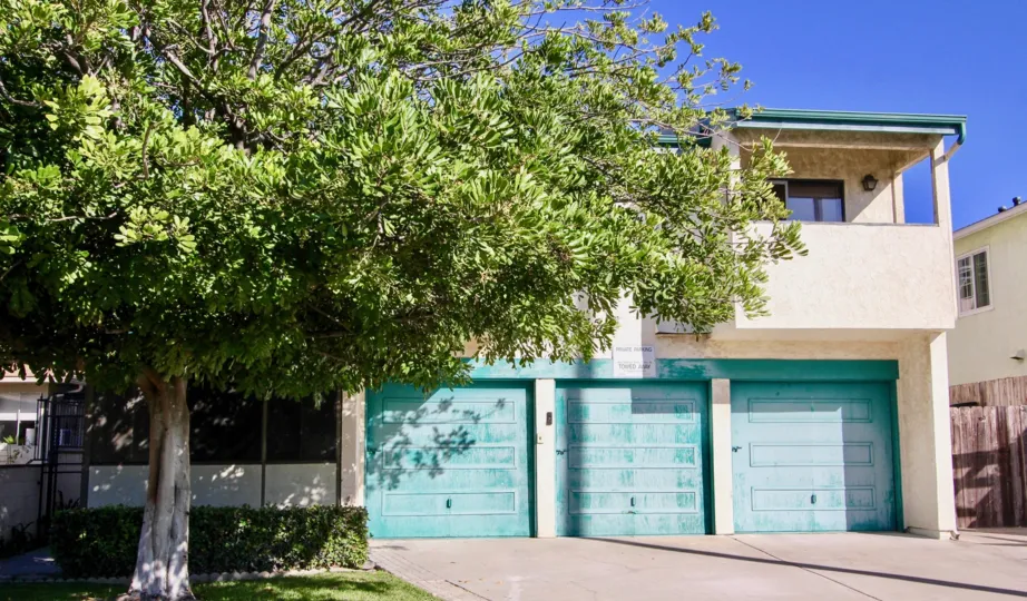 A nice three car garage, shaded by trees, in the Hamilton Street Condos in Normal Heights.
