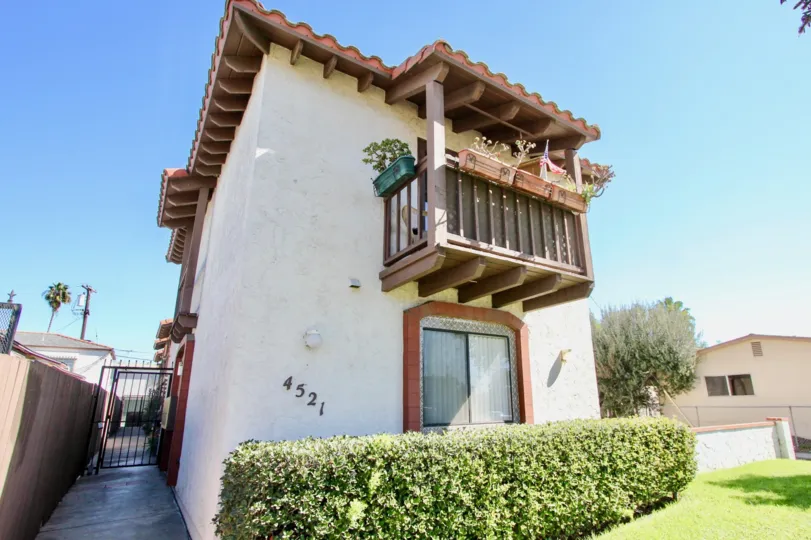 Single balcony with wooden frames and green lawn in Hawley Villas.