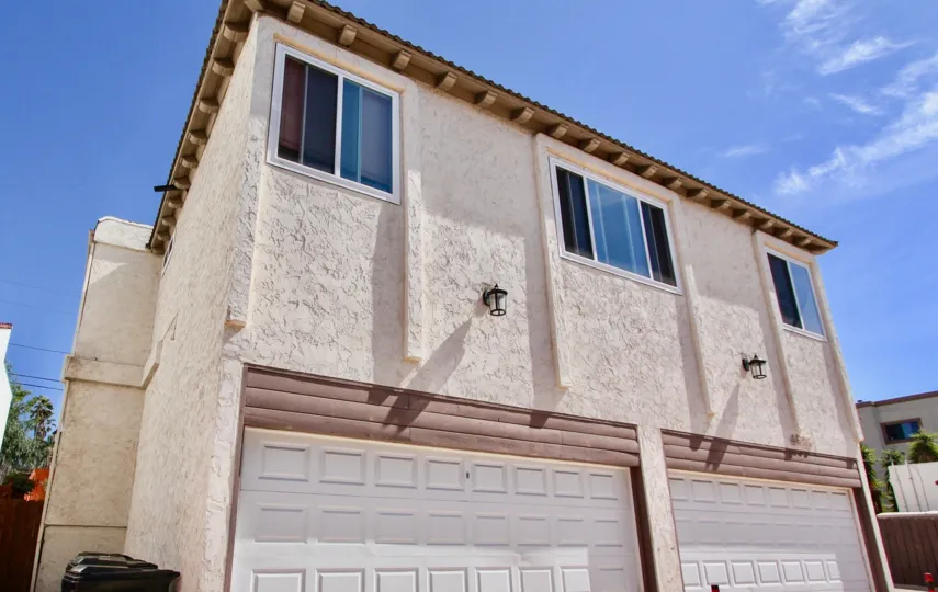 Blue sky in Normal Hights, CA in the background of a house.
