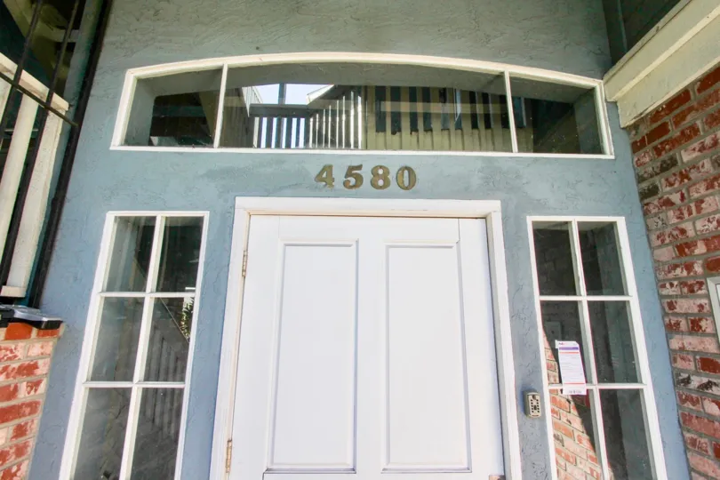 A sunny day in the area of Madison Ave, entrance, door, door bell, windows, brick