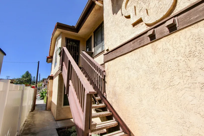 A sunny day in the area of Madison Park, stairs, outside, sidewalk, door, trees, telephone pole