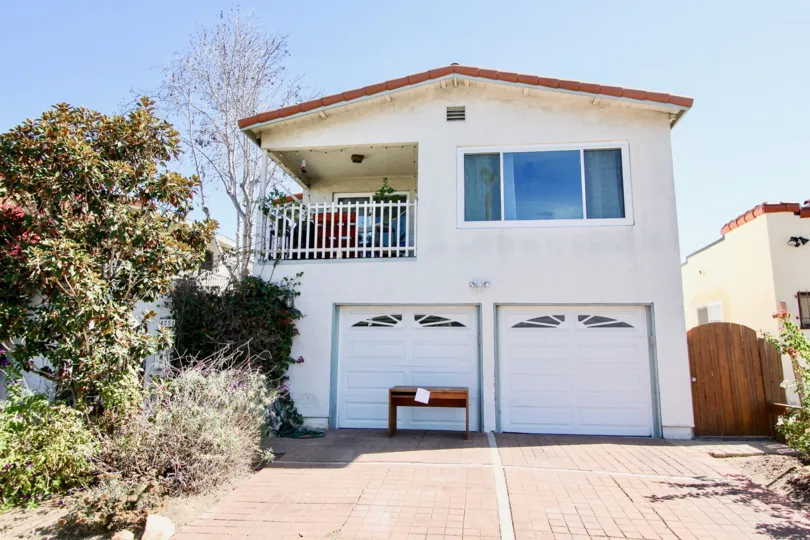 A Bright sunny day showing ample of parking place in front of a house with trees around in Mission Villas II of Normal Heights