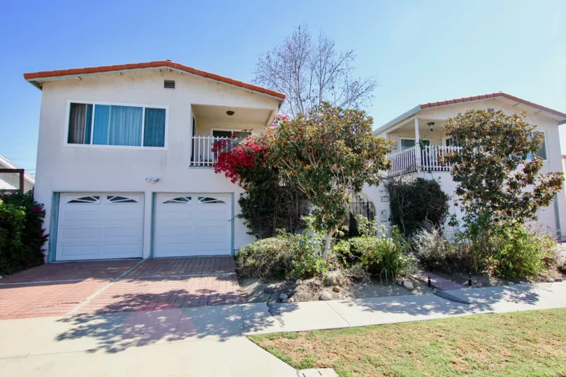 Duplex, two car garage, large balcony, gated entrance, well landscaped, tile roof, stucco exterior