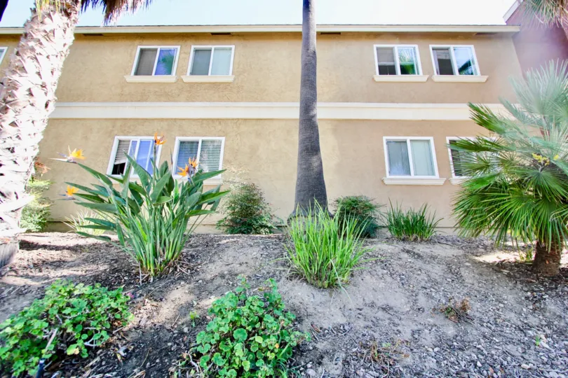 A view of Garden in front of a brown building in Monroe Villas II community.