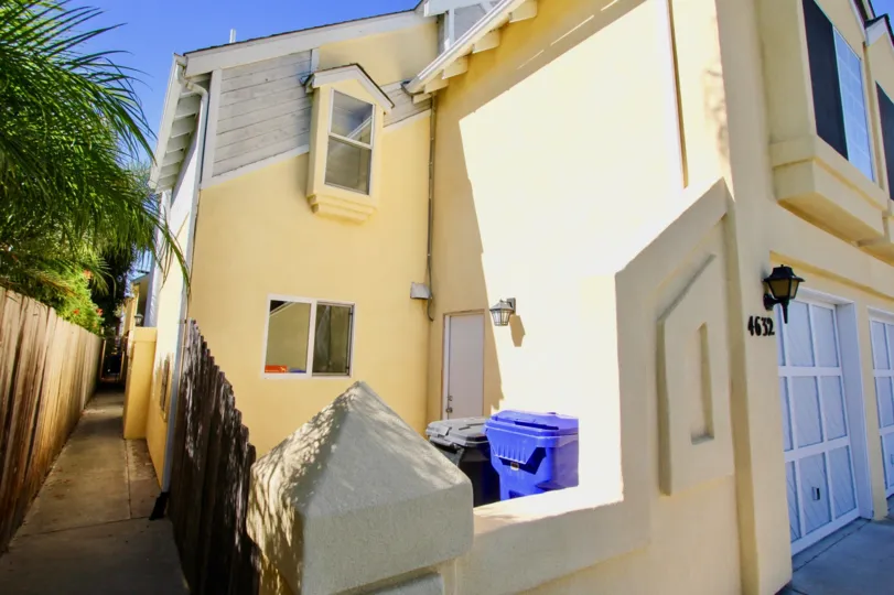 Apartment number has 4632 with light lamp and two dustbins of community Norman House II
