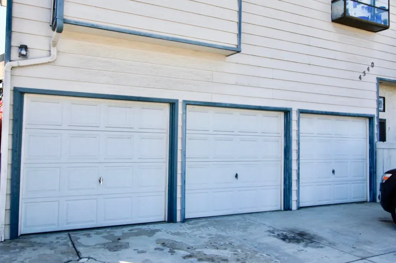 THE BUILDING IN THE NORTH COURT WITH THE SHUTTERS, BULP CAR PARKING