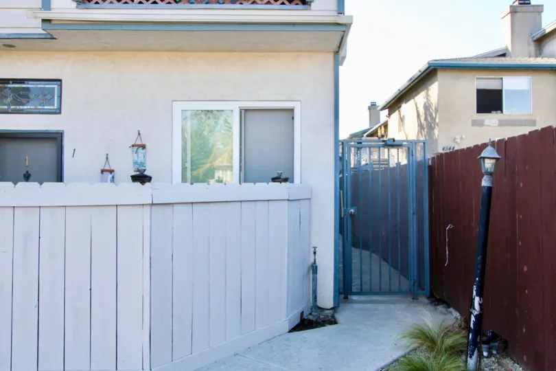 Side gate and short fence at North Court community in Normal Heights, California