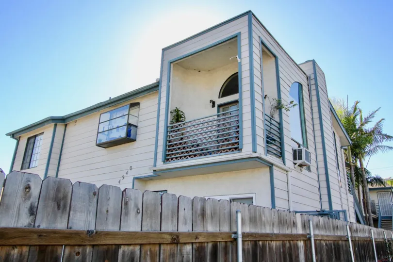 The side of a house in North Court in Normal Heights on a sunny day.