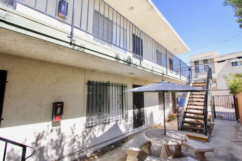 A outdoor seating area behind a housing block in the Oaktree Villas community of Normal Heights, California.