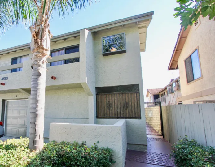 A sunny day in the area of Ohio Villas, outside, balcony, palm tree, stairs, windows